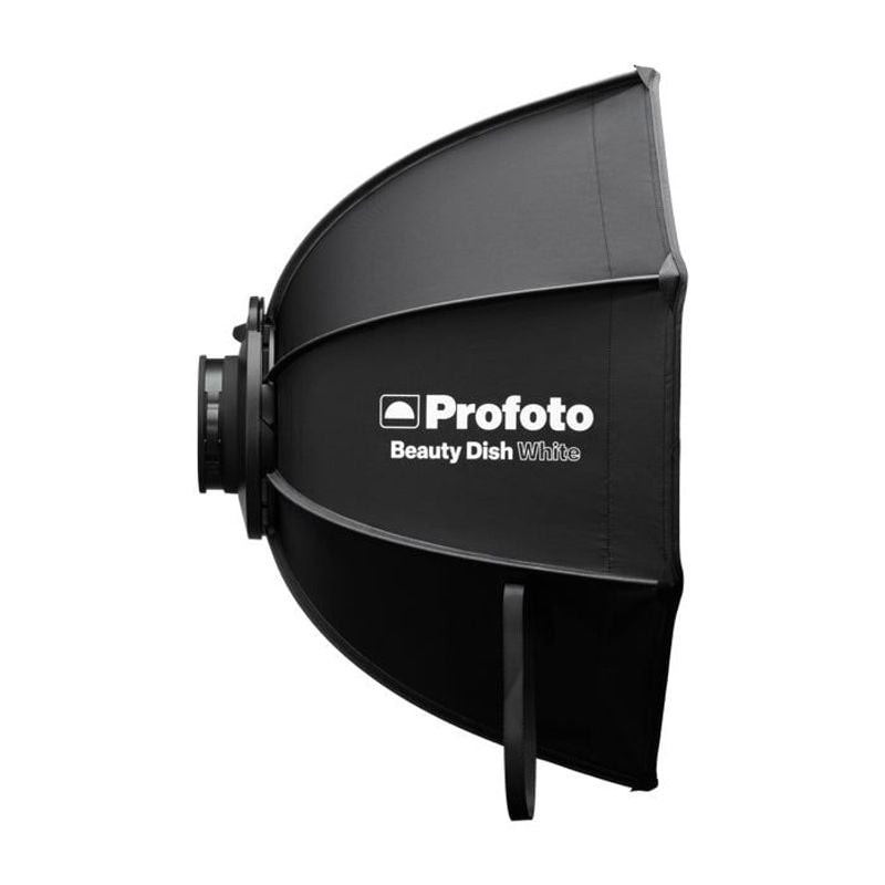 Profoto Beauty Dish Blanc 60 cm replié à plat, démontrant son design portable et peu encombrant.
